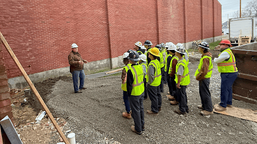 Construction workers by building